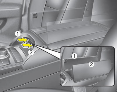 To open the center console storage, push the button (1) or (2).