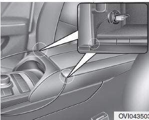 When using the front power outlet, you can close the center console cover after