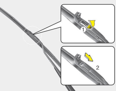 2. Open the cover of the blade. Press the clip behind the wiper arm and remove