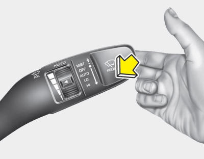 In the OFF position, pull the lever gently toward you to spray washer fluid on