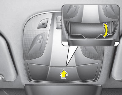 To open the sunglass holder, press the cover and the holder will slowly open.